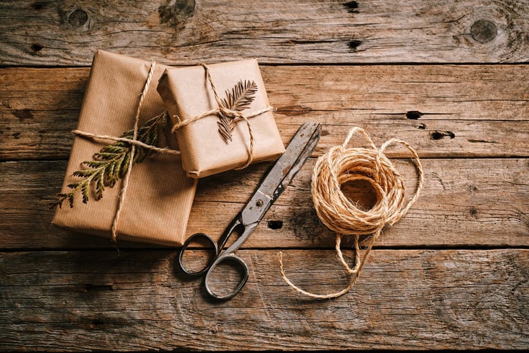Gifts wrapped in brown paper with twine
